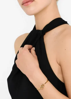 Bracciale rigido con anelli intrecciati