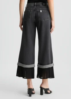 Jeans flare con orlo plissé