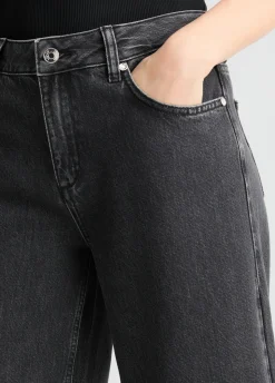 Jeans flare con orlo plissé
