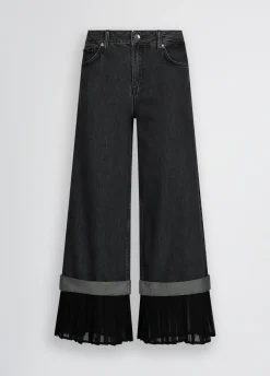 Jeans flare con orlo plissé