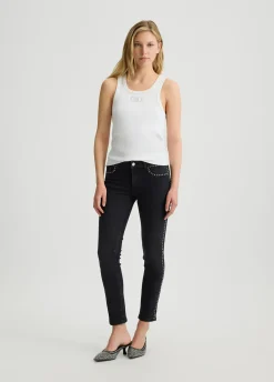 Jeans skinny con borchie