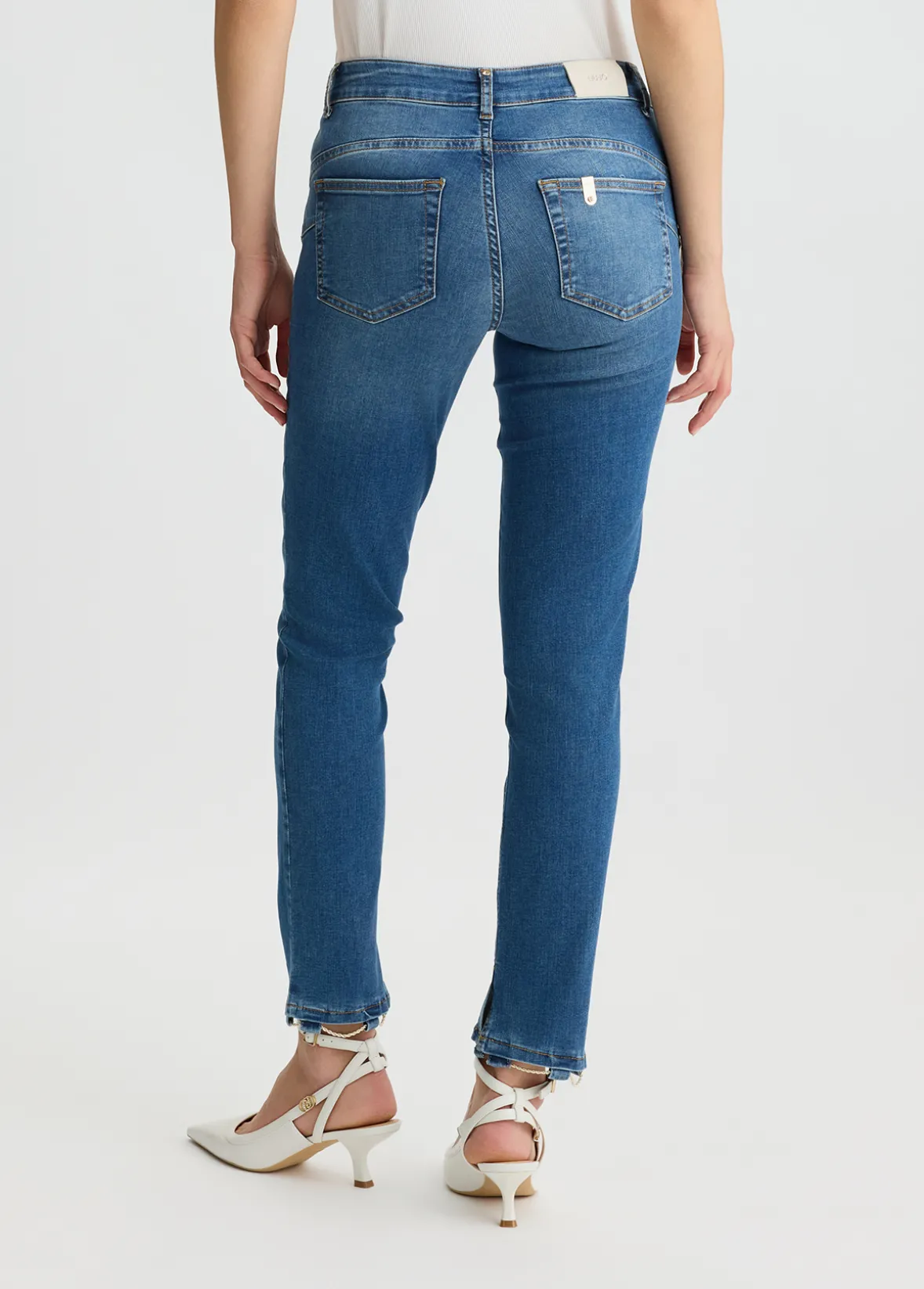 Jeans skinny con catene