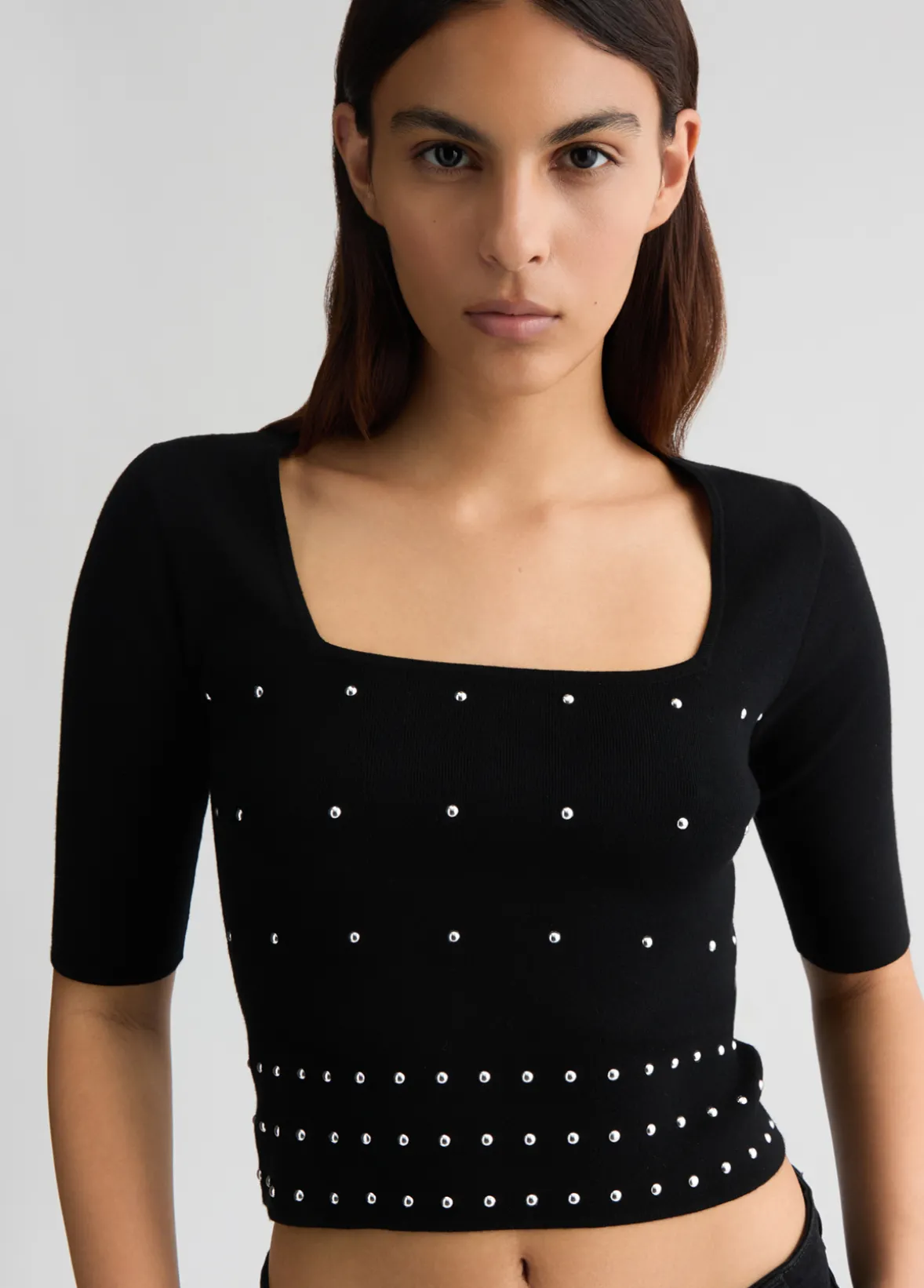 Maglia con borchie