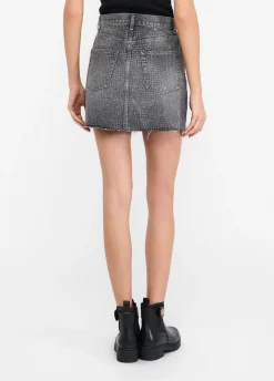 Minigonna in denim con borchie