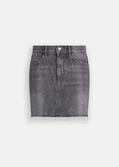 Minigonna in denim con borchie
