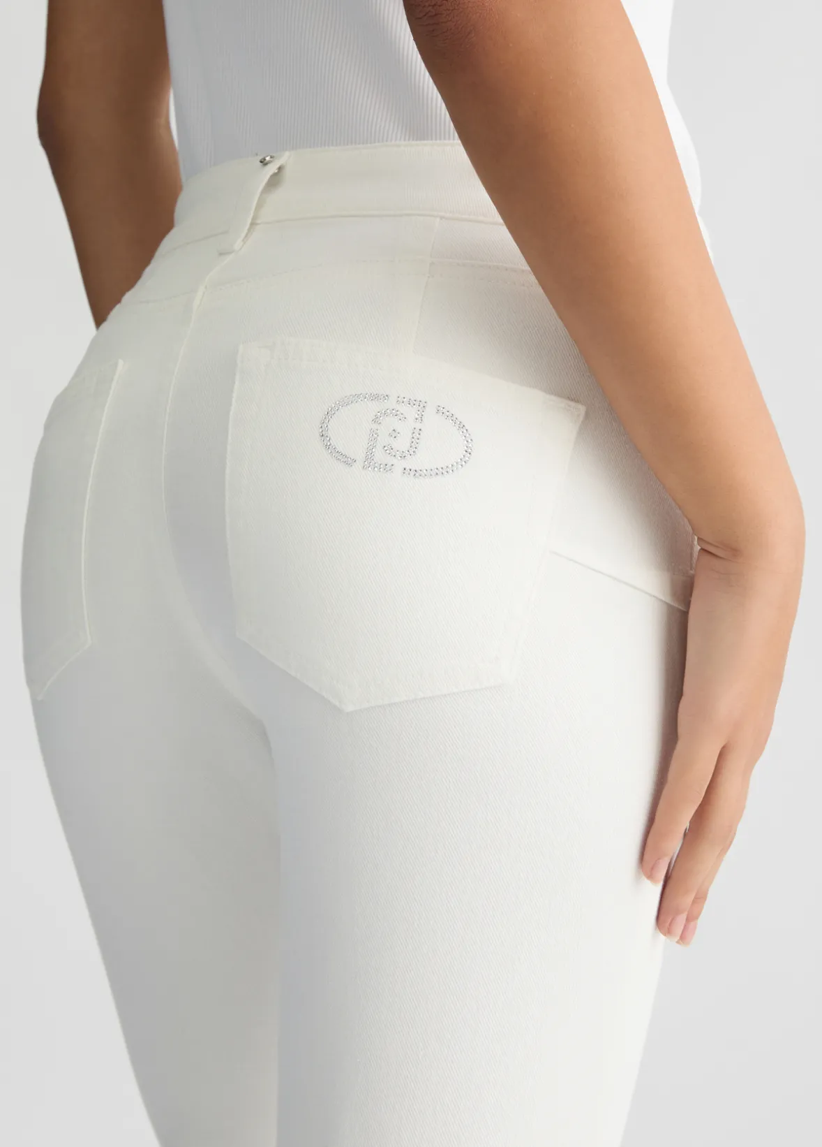 Pantaloni bootcut con logo strass