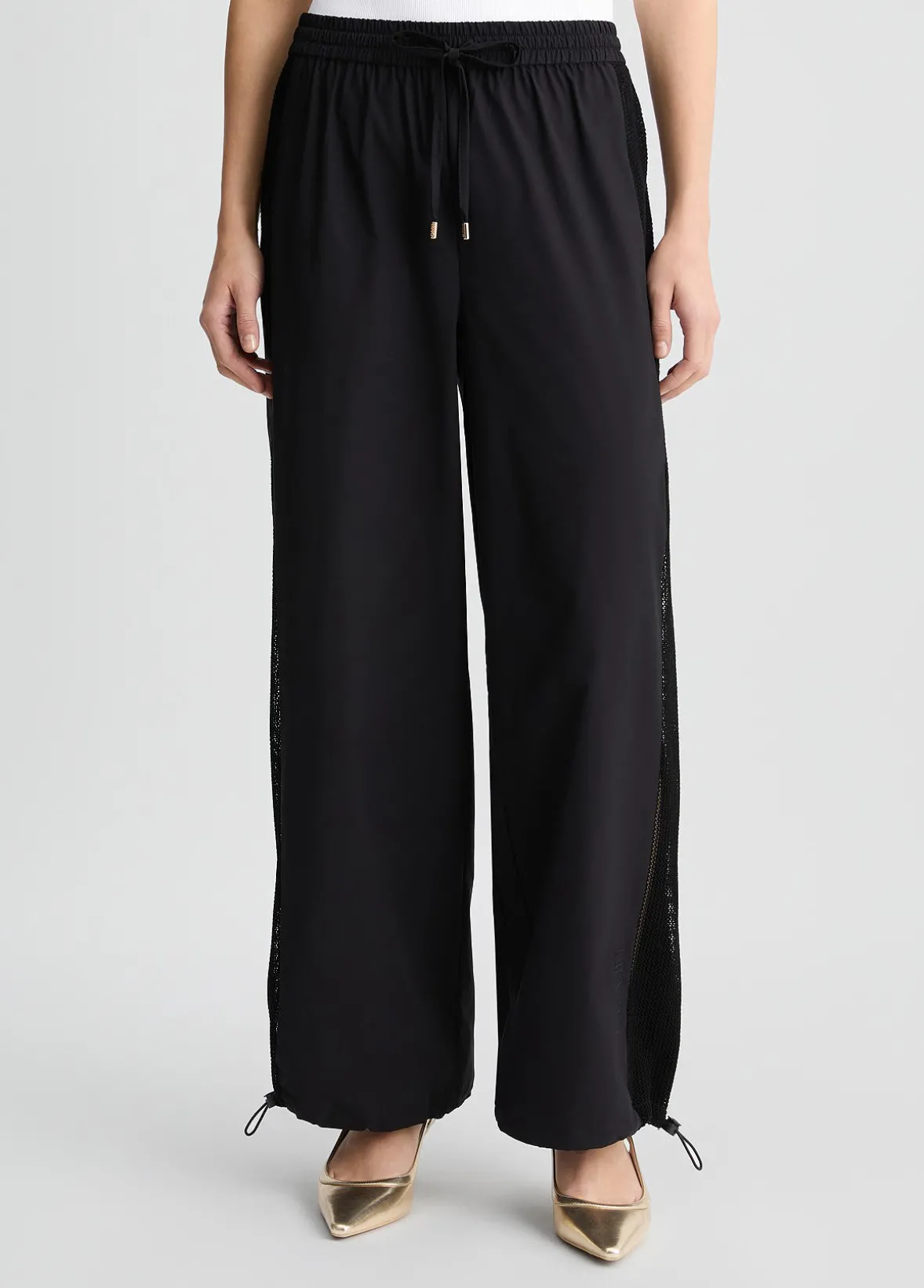 Pantaloni con inserto in rete