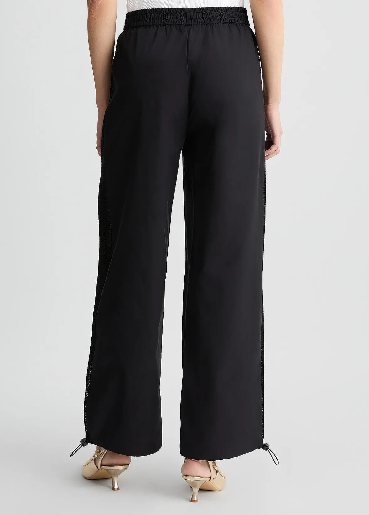 Pantaloni con inserto in rete