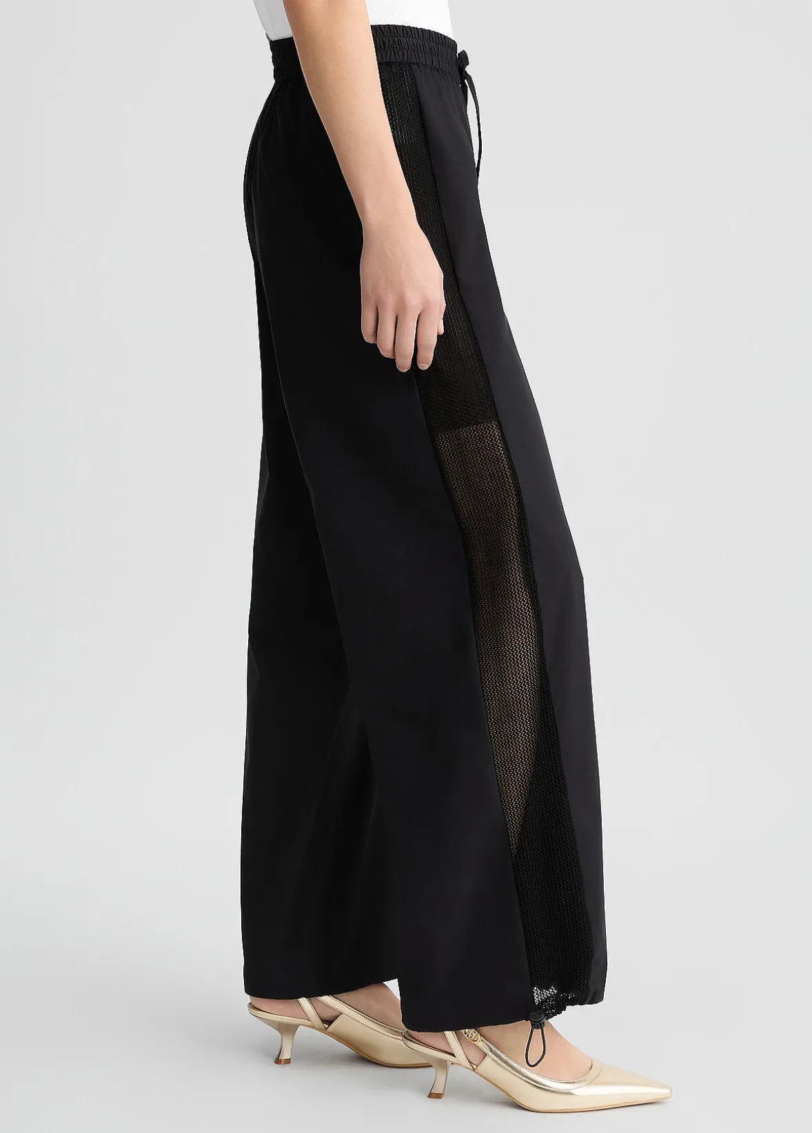 Pantaloni con inserto in rete