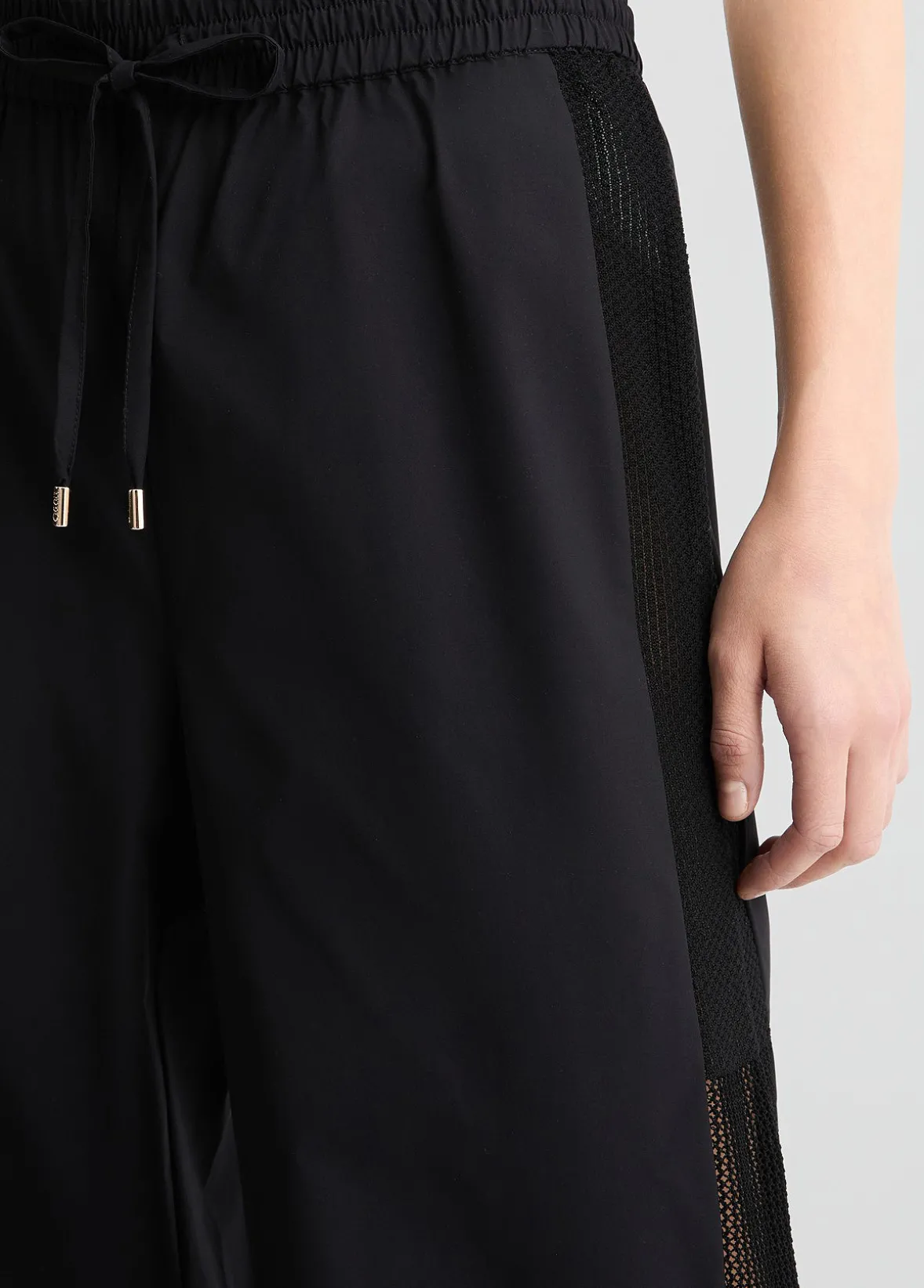 Pantaloni con inserto in rete