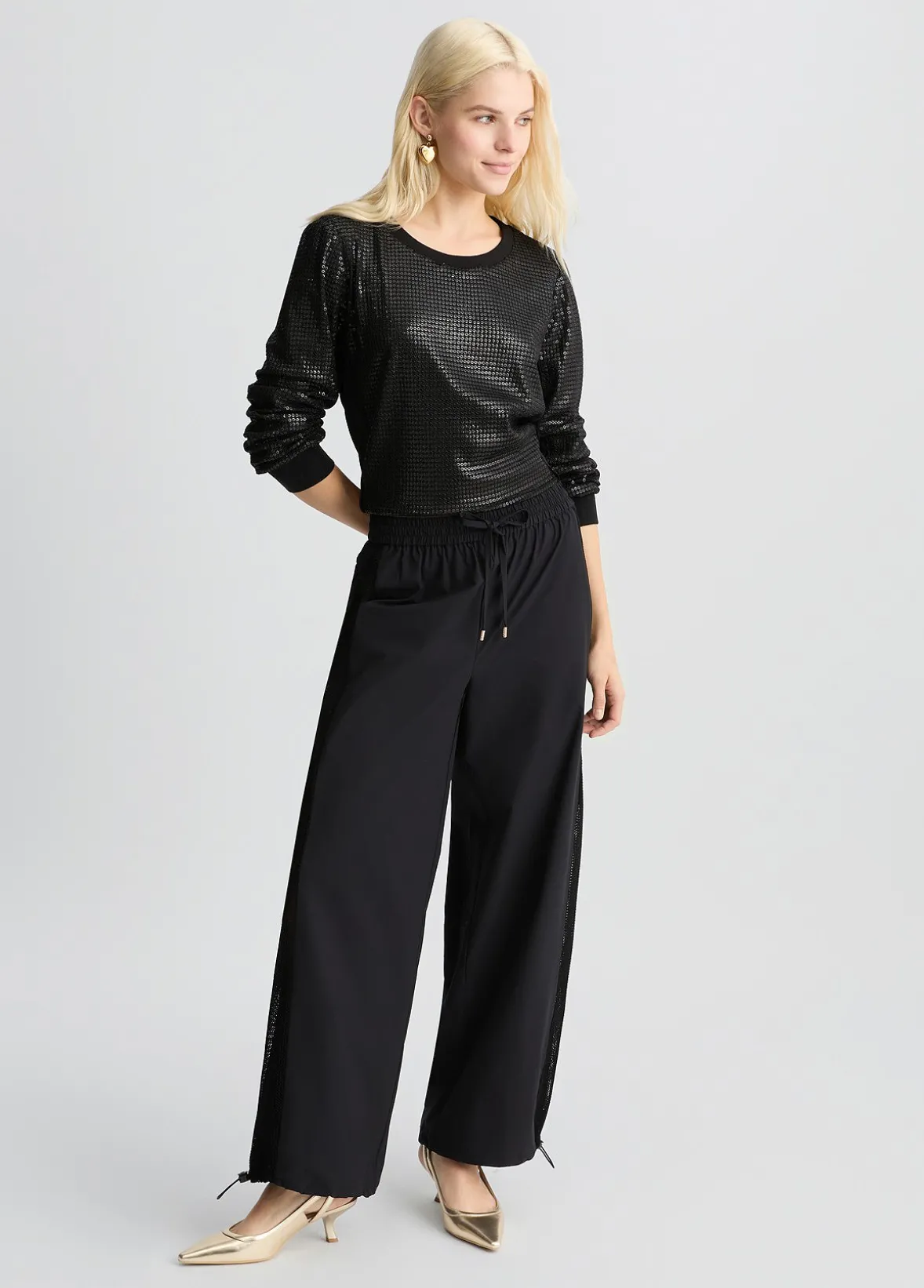 Pantaloni con inserto in rete
