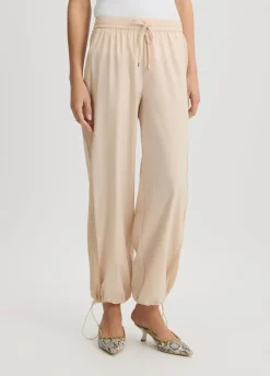 Pantaloni con inserto in rete