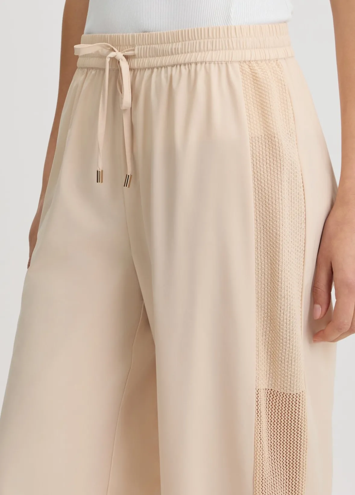 Pantaloni con inserto in rete