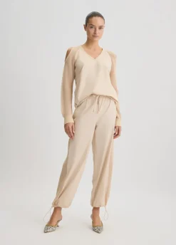Pantaloni con inserto in rete