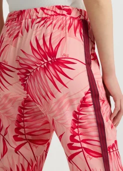 Pantaloni con stampa palme