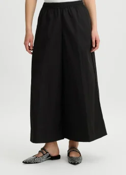 Pantaloni cropped a palazzo