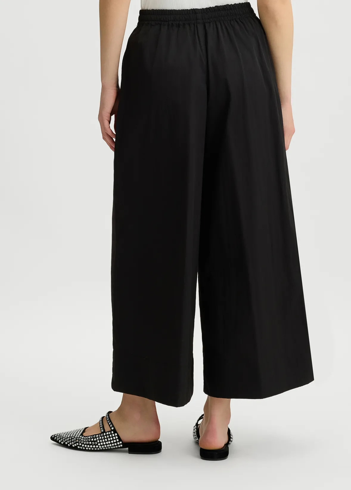 Pantaloni cropped a palazzo