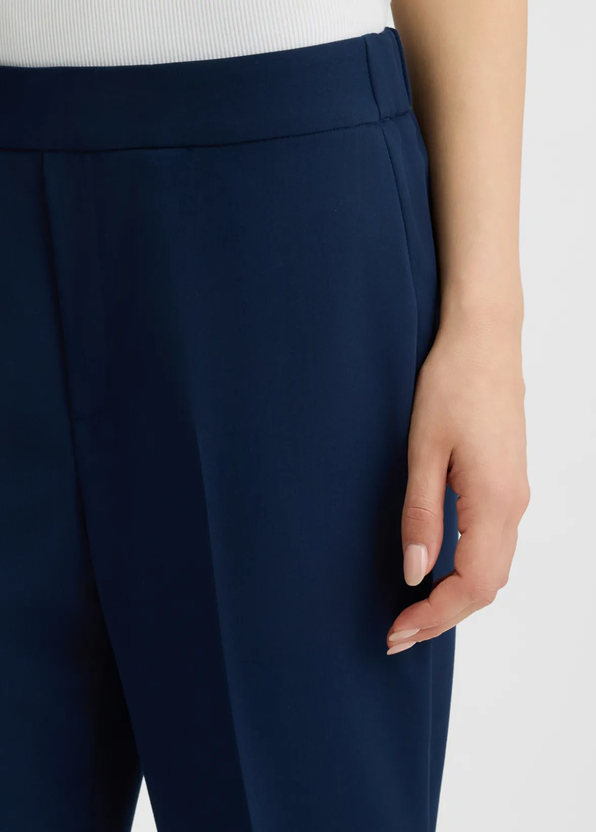 Pantaloni cropped con piega