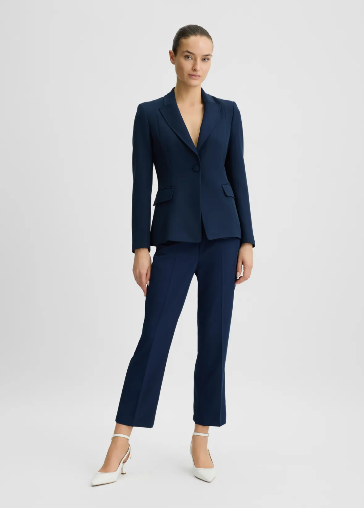 Pantaloni cropped con piega