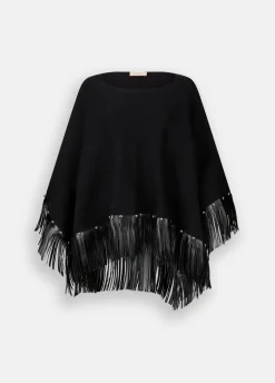 Poncho con frange e borchie