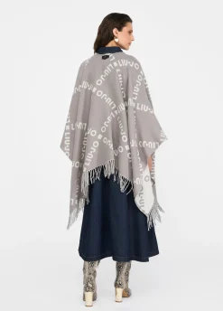 Poncho con logo e frange