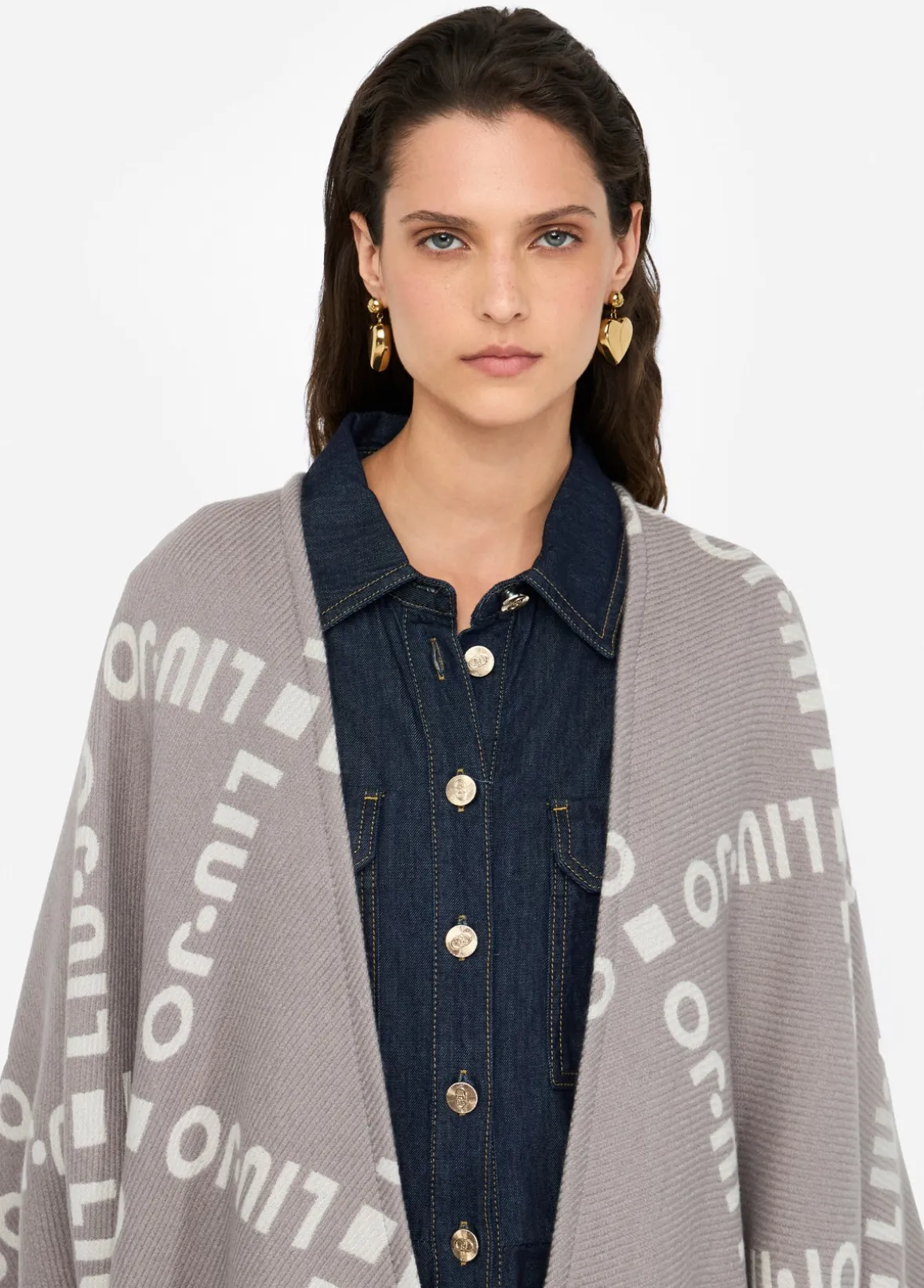 Poncho con logo e frange