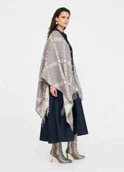 Poncho con logo e frange