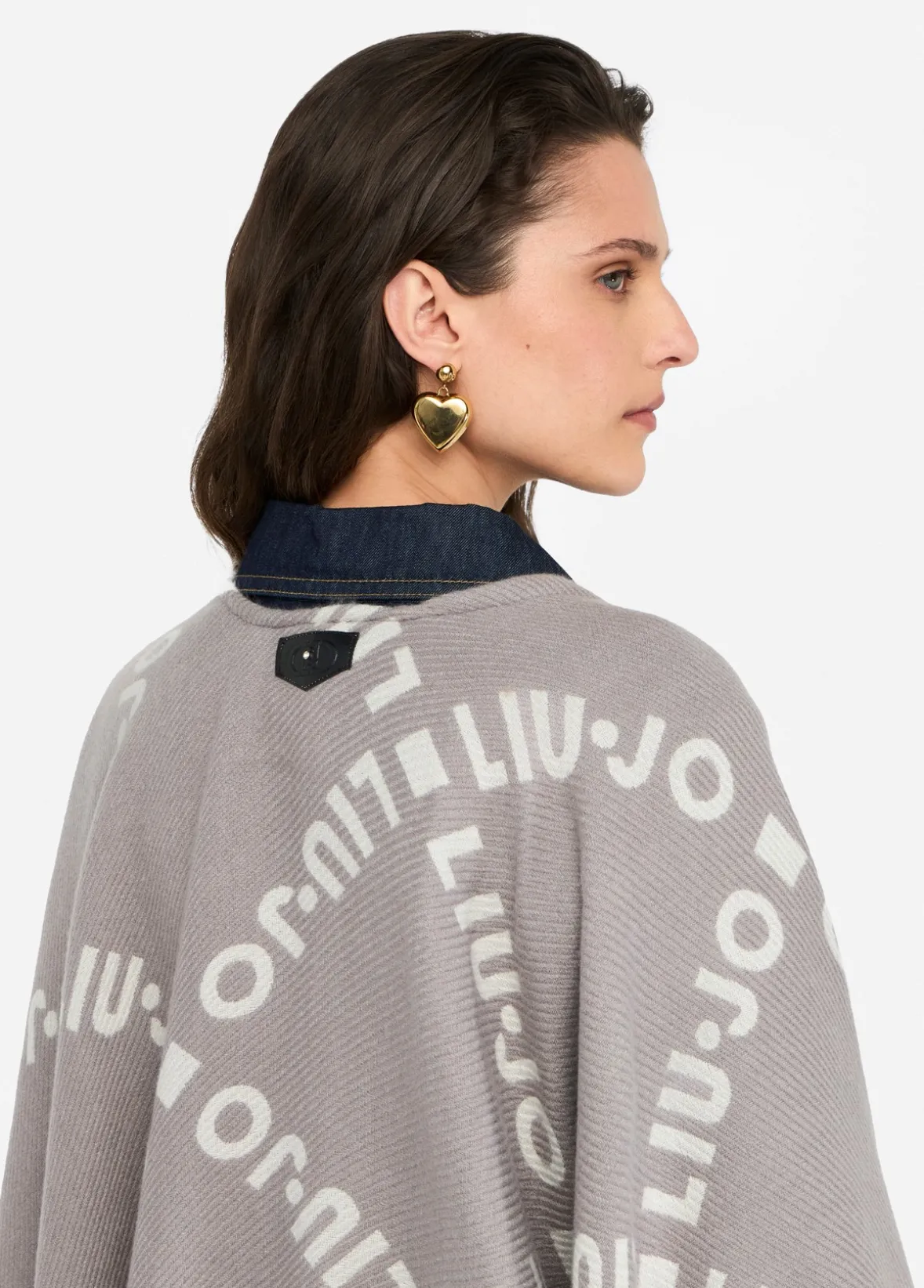 Poncho con logo e frange