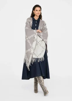 Poncho con logo e frange
