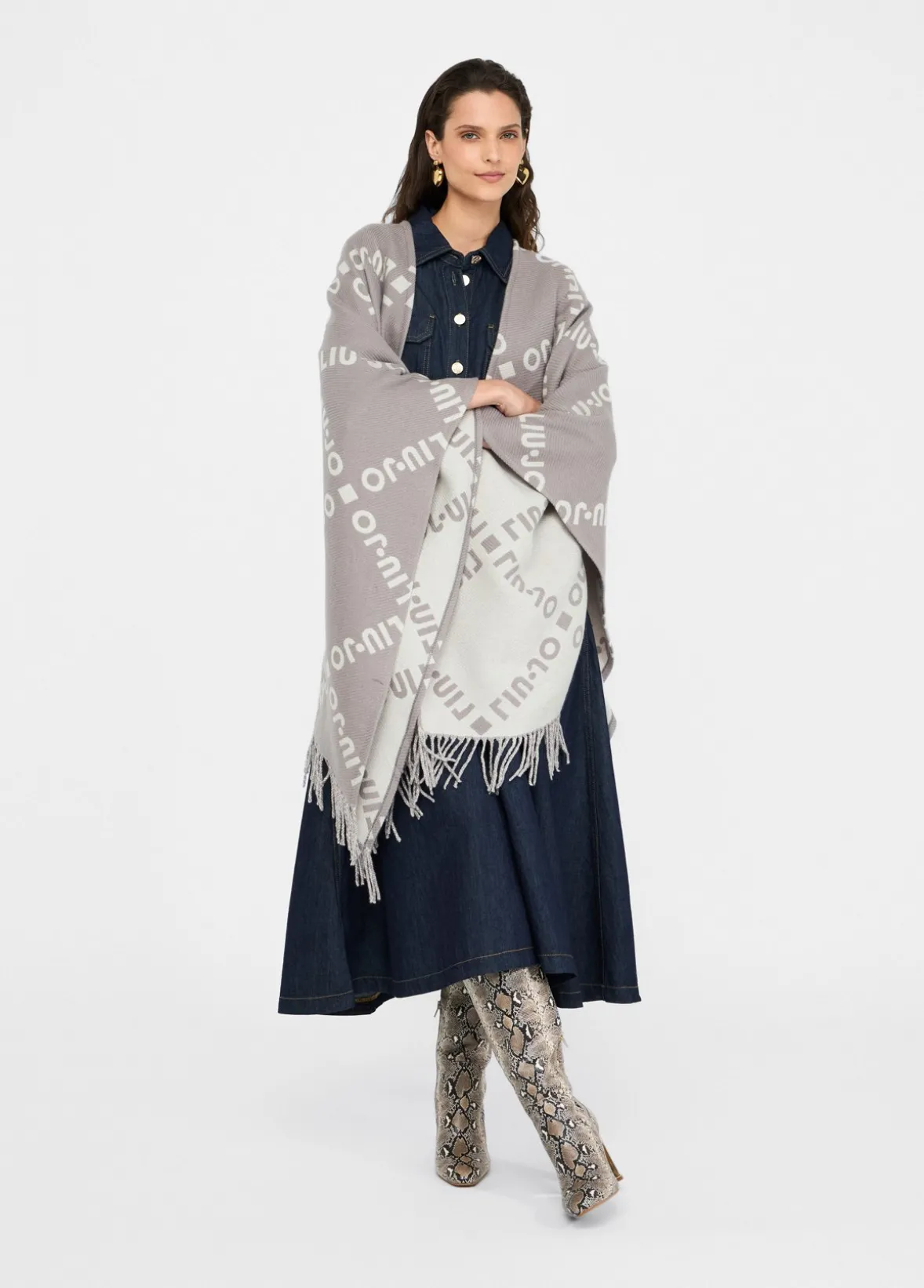 Poncho con logo e frange