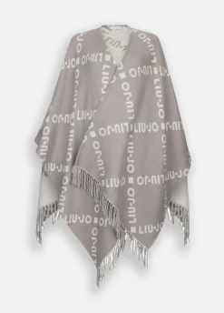Poncho con logo e frange