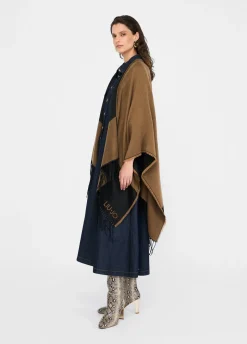 Poncho con logo e frange