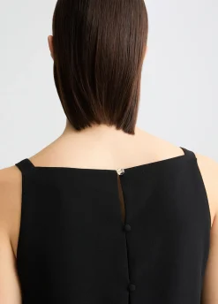 Top elegante con piume