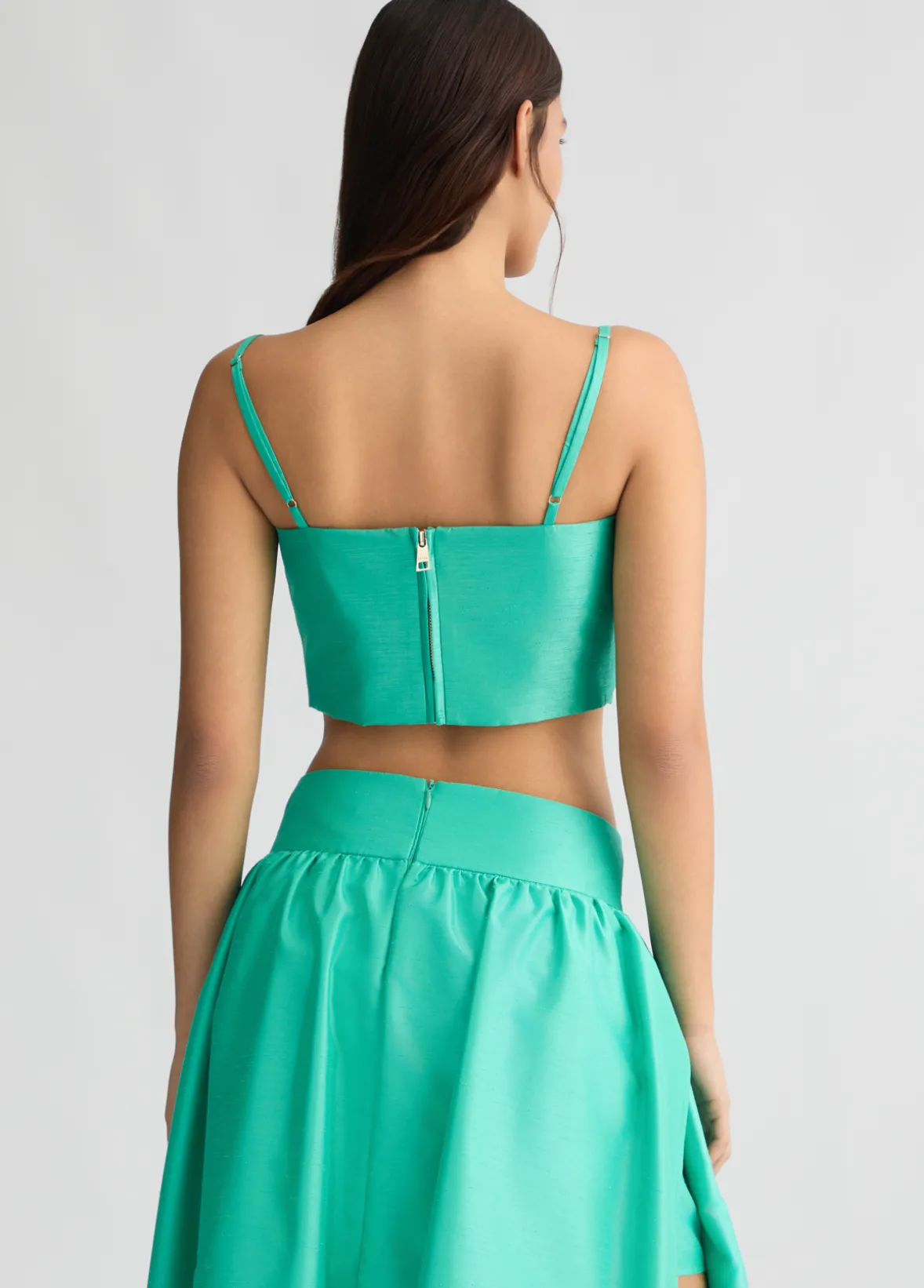 Top turchese con fiocco