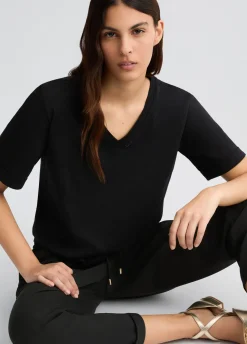T-shirt con logo e strass