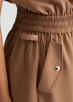Tuta corta con zip