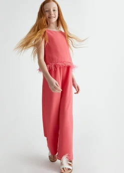 Tuta elegante con piume